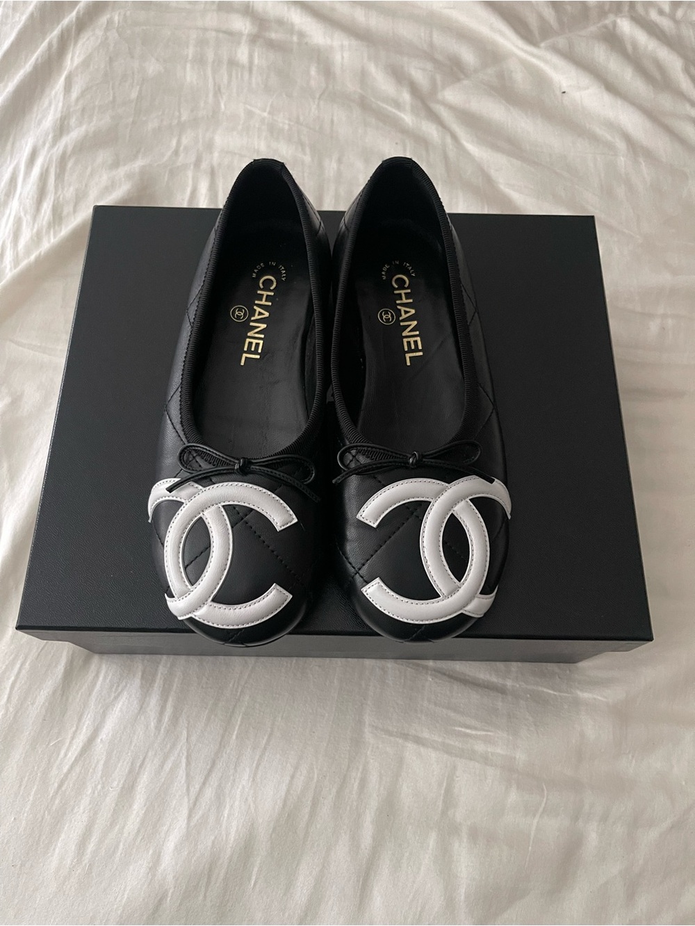 CHANEL Black Leather Quilted Flats with White CC Toe Logo